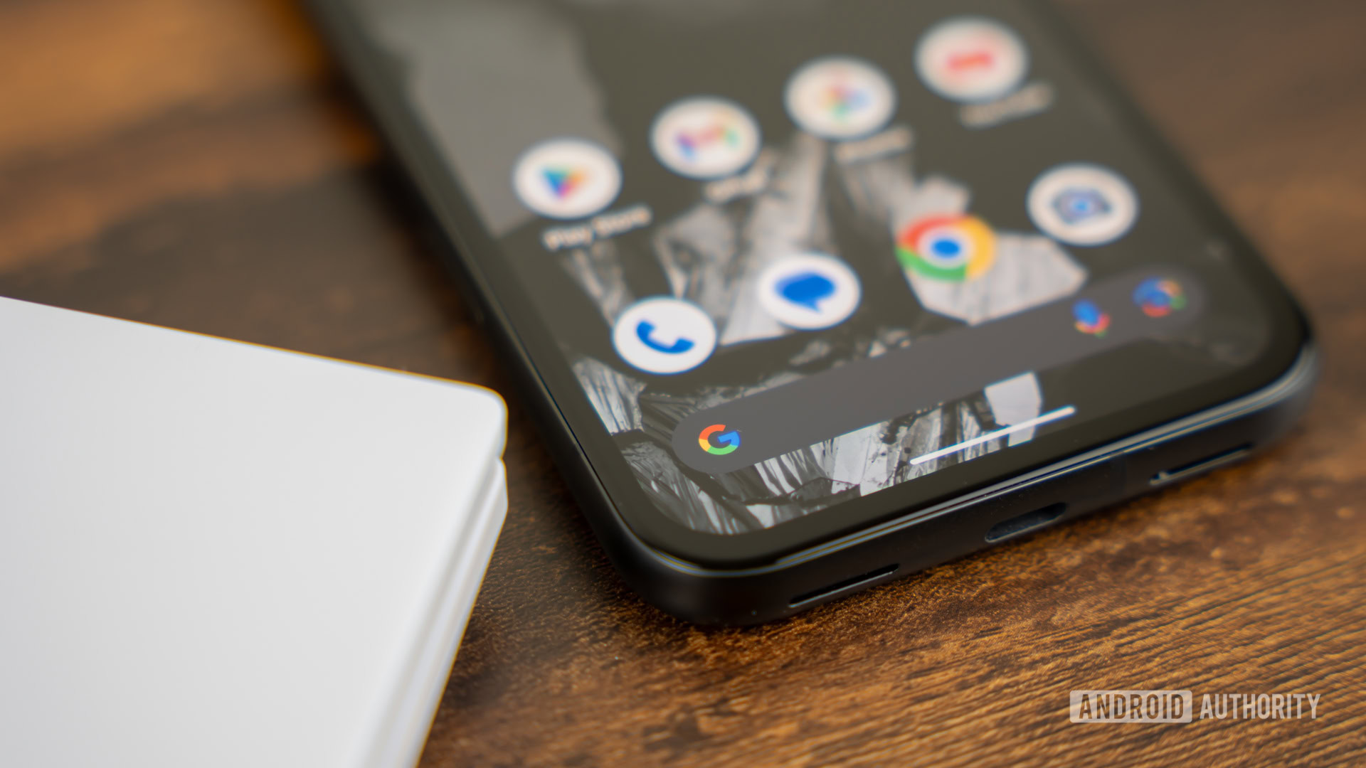 Google Search on smartphone stock photo (4) Phone on table