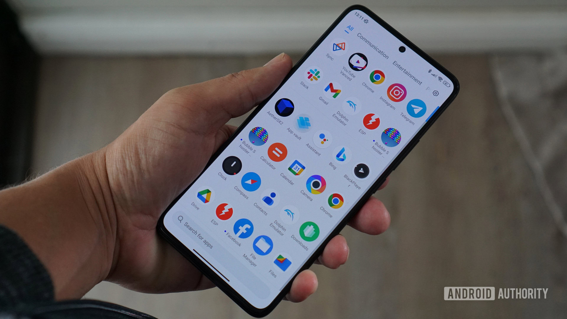 Poco F5 Pro in hand looking at screen Digital receipts are a way that tech has made life worse